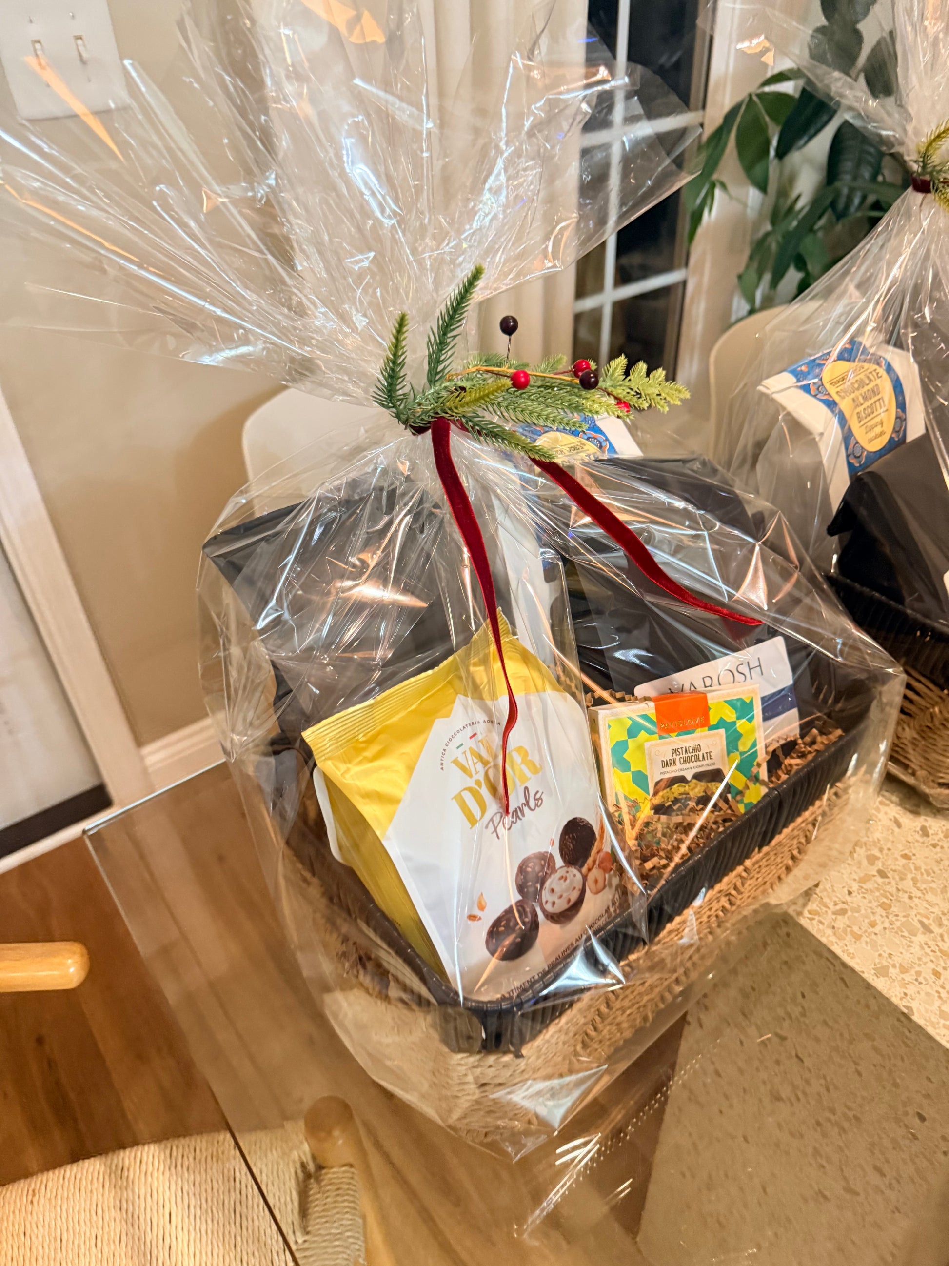 Decorative basket wrapped with VAROSH coffee beans and assortment of snacks