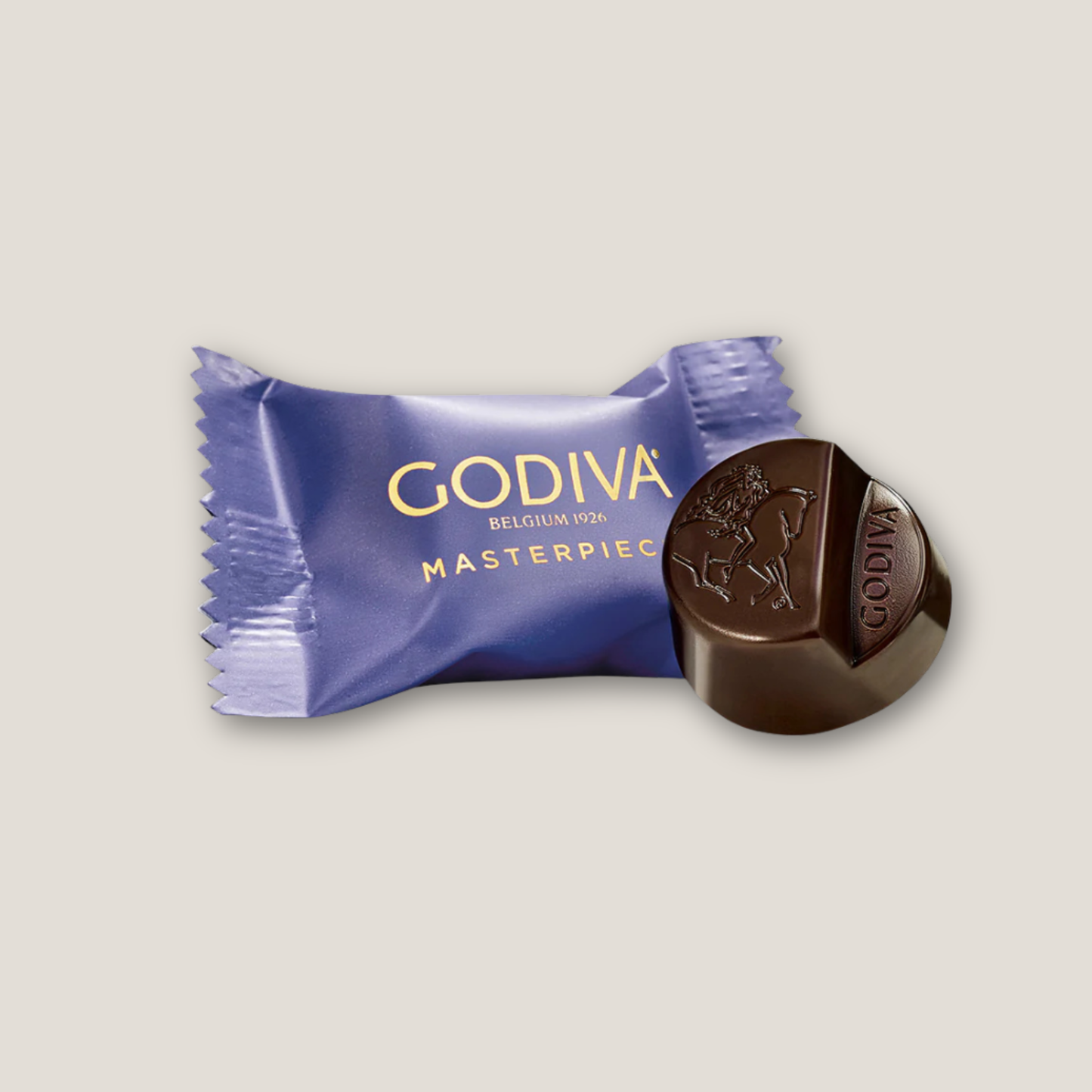 Godiva chocolate bar with purple packaging on a light gray background